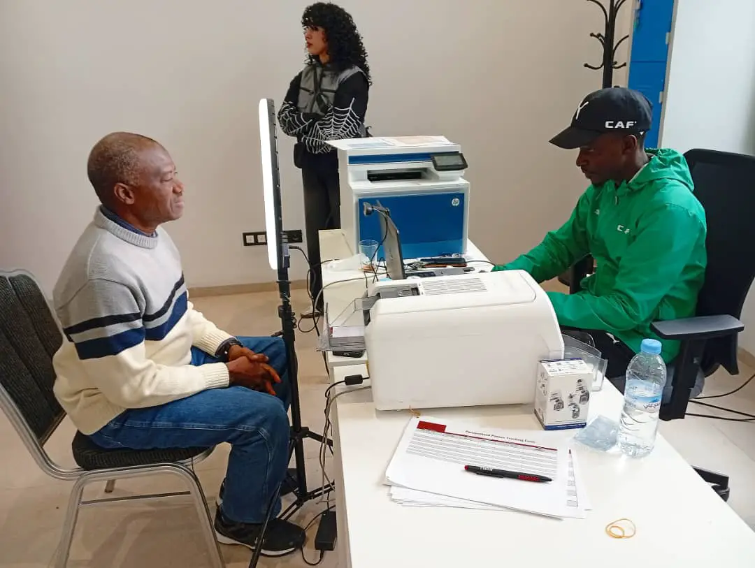 AFCON 2025 Diary, Day 3: Morocco’s Arab Cup Glory, Eagles’ Camp In Fez And CAF’s Historic Decision Mumini Alao (left) undergoes the formalities for procuring AFCON 2025 Media Accreditation Tag in Fez